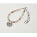 A handcrafted spring-inspired necklace featuring sun hematoid quartz beads, a floral pendant, and a rhodium chain.