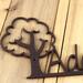 Close up of copper vein powder coat on our kid metal name plaque with oak tree.