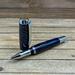 Blue resin and pinecone rollerball pen