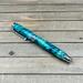 Green and turquoise resin fountain pen with chrome hardware