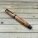 Gunmetal and burl wood rollerball pen