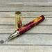 red and gold resin pen