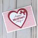 A valentine card kit to DIY 6 cards with pink embossed cardstock, cardstock "Happy Valentine's Day" embellishments and cards/envelopes.