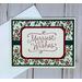 A Christmas card kit with holly scrapbook paper, green cardstock mat, "Merriest Wishes" stamped sentiments and green ribbons.