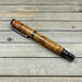rare amboyna burl wood pen with gunmetal hardware