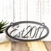 Oval established year metal plaque, in silver vein powder coat.