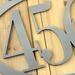 Close up of raw steel on our oval metal house number sign.