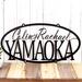 Personalized oval metal sign with first and last names, in matte black powder coat.