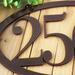 Close up of copper vein powder coat on our oval metal house number sign.