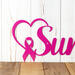 Close up of pink ribbon and heart on our breast cancer survivor metal wall art.