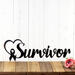 Breast cancer survivor metal wall decor, with a heart and ribbon, in matte black powder coat.