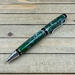 emerald green and silver cigar style ballpoint pen