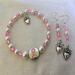 E4
Pink beads and white pearls with heart charm
