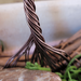brown wire twisted into trunk and roots attached to grapevine wreath