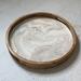 Soft neutral colors with ribbons of gold on this 15" wooden serving tray.  Finished in a durable, glossy resin.
