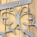 Close up of raw steel on the garden hanging sign.