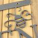 Close up of silver vein powder coat on the garden hanging sign.