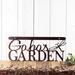 Personalized metal garden hanging sign with first name and dragonfly, in copper vein powder coat.