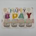 Birthday card with watercolor cupcakes accented with shiny paints on balloon background, candles say happy bday