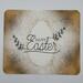 Gold Easter egg splattered paint with the sentiment Happy Easter accented with glitter sprigs 