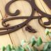 Close up of copper vein powder coat on our metal monogram sign.