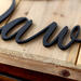 Close up of matte black powder coat on our kitchen metal sign.