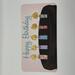 Watercolor chocolate cake with 5 birthday candles accented in shiny paint to make the flames really “glow”