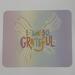 Watercolor backdrop featuring yellow striped bow with rainbow letters “I Am So Grateful”