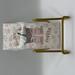 Laminated bookmark with stack of books with pink bow, iced coffee, on pink floral background 