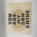 8x8 children’s books all art featuring watercolor sun and the text you are my sunshine accented in gold glitter
