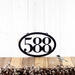 Horizontal oval 3 digit metal house number sign, in matte black powder coat.
