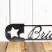 Close up of our baby nursery boy or girl metal safety pin sign with star, in raw steel.