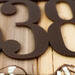 Close up of copper vein powder coat on our airplane house number sign.