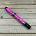 Pink rollerball pen with white flecks