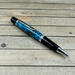 Turquoise resin and pinecones pen