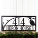 Personalized hanging rectangular metal address sign with great blue heron, cattails, and sunset image, in matte black powder coat.