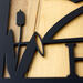 Close up of matte black powder coat of our personalized metal address plaque with cattails and great blue heron.