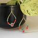 Fun, bright and fresh watermelon earrings, with seed beads in orange, red, green and teal. Gold plated French hook. 1 3/4" long by 1" wide.
