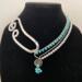 Mist
A bright light blue glass bead paired with a lovely light grey pearl. 