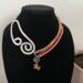 Ember
A beautiful orange glass bead paired with a coral color pearl 