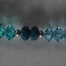 Glass bead and crystal with silver accent beads. 7 1/2 inch stretch bracelet.