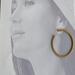 Model wearing Golden grass large hoop earrings
