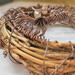 closeup grapevine wreath with brown aluminum wire roots attached
