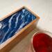 Waves design on this 5-compartment tea box is perfect for the tea and ocean lover.