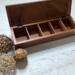 5-compartment in this wooden tea box for organizing tea bags.