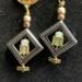 Natural hematite stone and glass beads, wire wrapped decorative head pin, and statement stainless steel ear studs loop butterfly backers.