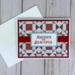 A 4th of July card making kit with cardstock, quilt scrapbook paper, stamped sentiments and mats, ribbons and cards and envelopes.
