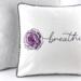 14" pillow embroidered with the word breathe as the stem of a purple rose stitched on white quilted fabric with black & white striped piping