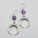 Handmade earrings with amethyst coin beads and stainless steel crescent moons, Argentium sterling ear wires, 2.25 inches long.