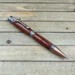 Exotic hardwood cowboy themed pen in antique copper 